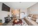 Open-concept living room features dining area and comfortable seating; perfect for relaxing or entertaining at 4400 S Quebec St # 107, Denver, CO 80237