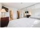 Inviting main bedroom includes closet, adjacent bathroom, and plenty of natural light at 4400 S Quebec St # 107, Denver, CO 80237