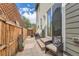 Private backyard with patio, seating area, and wood fence at 8036 E 53Rd Dr, Denver, CO 80238