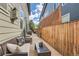 Private backyard with patio, seating area, and wood fence at 8036 E 53Rd Dr, Denver, CO 80238