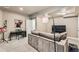 Finished basement with a comfortable couch and entertainment area at 8036 E 53Rd Dr, Denver, CO 80238