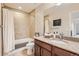 Bathroom with tub, shower, granite vanity, and tile flooring at 8036 E 53Rd Dr, Denver, CO 80238