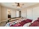 Bright bedroom with a queen bed and en-suite bathroom access at 8036 E 53Rd Dr, Denver, CO 80238
