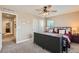 Second bedroom with a queen bed, ceiling fan and lots of light at 8036 E 53Rd Dr, Denver, CO 80238