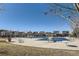Community pool with diving board and surrounding seating at 8036 E 53Rd Dr, Denver, CO 80238