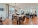Open concept dining and living area with hardwood floors and fireplace at 8036 E 53Rd Dr, Denver, CO 80238
