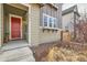 Red front door and walkway leading to the home's entry at 8036 E 53Rd Dr, Denver, CO 80238