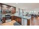 Modern kitchen with dark brown cabinets and granite countertops at 8036 E 53Rd Dr, Denver, CO 80238