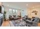Living room with hardwood floors, comfy seating, and a fireplace at 8036 E 53Rd Dr, Denver, CO 80238