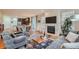 Living room with hardwood floors, fireplace, and open floor plan at 8036 E 53Rd Dr, Denver, CO 80238