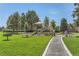 playground with play structures, slides, and shaded area at 8036 E 53Rd Dr, Denver, CO 80238