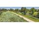 Scenic walking path alongside lush greenery and trees at 8036 E 53Rd Dr, Denver, CO 80238