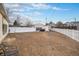 Large backyard featuring a white picket fence at 1683 Monroe St, Strasburg, CO 80136