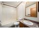 Bathroom featuring a tub/shower, toilet, sink and vanity at 1683 Monroe St, Strasburg, CO 80136