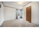 Bright bedroom with neutral carpet, natural light and wood trim at 1683 Monroe St, Strasburg, CO 80136
