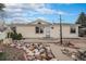 Charming home featuring a well-maintained exterior with inviting front yard landscaping at 1683 Monroe St, Strasburg, CO 80136