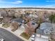 A high angle aerial view shows the property with neighborhood proximity to water features at 2687 E 124Th Pl, Thornton, CO 80241