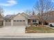 Attractive home with three-car garage, well-maintained lawn, mature tree, and solar panels at 2687 E 124Th Pl, Thornton, CO 80241