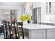Bright kitchen features a large island with seating and stainless steel appliances at 2687 E 124Th Pl, Thornton, CO 80241