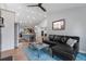Open concept living room showcasing the kitchen with a view of the front door at 2687 E 124Th Pl, Thornton, CO 80241