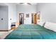 Spacious main bedroom featuring vaulted ceilings, ceiling fan, closet, and ensuite bathroom access at 2687 E 124Th Pl, Thornton, CO 80241