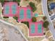 Aerial view of three vibrant tennis courts and a park trail in the community at 2687 E 124Th Pl, Thornton, CO 80241