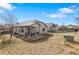 Spacious backyard with a covered patio, ideal for outdoor gatherings and leisure at 157 Sand Cherry St, Brighton, CO 80601
