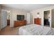 Bedroom with an attached bathroom and walk-in closet offers convenience and ample storage at 157 Sand Cherry St, Brighton, CO 80601