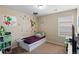 Bedroom with cartoon character wall decals, window, and carpet floors at 157 Sand Cherry St, Brighton, CO 80601