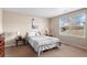 Bedroom with a large window and light-colored walls provides a bright and airy feel at 157 Sand Cherry St, Brighton, CO 80601