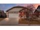 Charming single-Gathering home featuring a two-car garage and welcoming exterior at 157 Sand Cherry St, Brighton, CO 80601