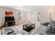 Cozy living room with soft carpet, a decorative table and large sectional sofa at 157 Sand Cherry St, Brighton, CO 80601