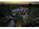 Majestic aerial view of an estate home at twilight, nestled among mature trees with a sprawling landscaped yard at 5 Walden Ln, Cherry Hills Village, CO 80121