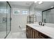 Bathroom featuring a shower, vanity with sink, and white tiled floor at 5 Walden Ln, Cherry Hills Village, CO 80121