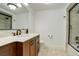 Modern bathroom with a sleek vanity, glass-enclosed shower, and contemporary fixtures at 5 Walden Ln, Cherry Hills Village, CO 80121