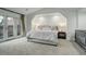 Bright bedroom with neutral decor, access to a balcony, and soft carpeting at 5 Walden Ln, Cherry Hills Village, CO 80121