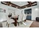 Elegant dining room with coffered ceilings, a modern bar, and hardwood floors at 5 Walden Ln, Cherry Hills Village, CO 80121