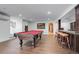 The game room includes a pool table and wet bar, perfect for entertaining guests at 5 Walden Ln, Cherry Hills Village, CO 80121