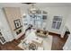 Aerial view showcasing a living room with a stone fireplace and high ceilings at 5 Walden Ln, Cherry Hills Village, CO 80121