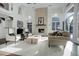 Bright living room features a stone fireplace, high ceilings, and lots of natural light at 5 Walden Ln, Cherry Hills Village, CO 80121