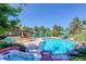 Resort-style backyard boasts a pool, hot tub, and outdoor kitchen area with ample seating for entertaining guests at 5 Walden Ln, Cherry Hills Village, CO 80121
