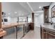 Custom wet bar with stainless steel appliances, dark wood cabinetry, and stone countertops at 5 Walden Ln, Cherry Hills Village, CO 80121