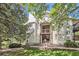 Charming exterior view of wood sided home with balcony overlooking green space at 17381 E Mansfield Ave # 711L, Aurora, CO 80013