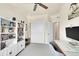Well-organized bedroom with desk, chair, bookcase, and closet, creating a functional and inviting living space at 18059 French Creek Ave, Parker, CO 80134