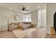 Comfortable living room with a cozy sectional sofa, stylish decor, and abundant natural light at 18059 French Creek Ave, Parker, CO 80134
