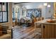 Inviting dining area with a wooden table, custom bench seating, and a decorative chandelier at 208 N Ridge St, Breckenridge, CO 80424