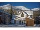 Charming home with snow-covered roof and mountain views at 208 N Ridge St, Breckenridge, CO 80424