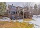 Spacious backyard featuring a well-maintained lawn, mature trees, a hot tub, and a multi-story home with large windows at 17820 Queensmere Dr, Monument, CO 80132