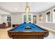 Spacious game room featuring a pool table with blue felt, light walls and neutral floors at 17820 Queensmere Dr, Monument, CO 80132