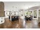 Bright and airy open floorplan featuring an eat-in kitchen with a large dining area and hardwood floors at 17820 Queensmere Dr, Monument, CO 80132